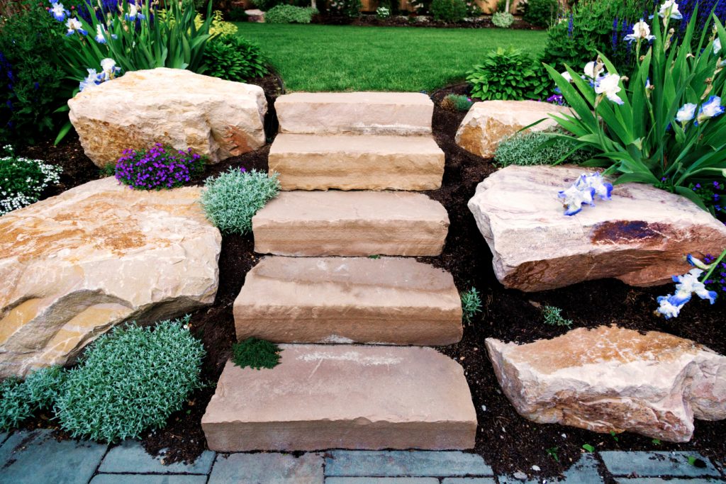 Often when people think of hardscaping, they imagine simple and low-maintenance rock yards, likely without much visual appeal