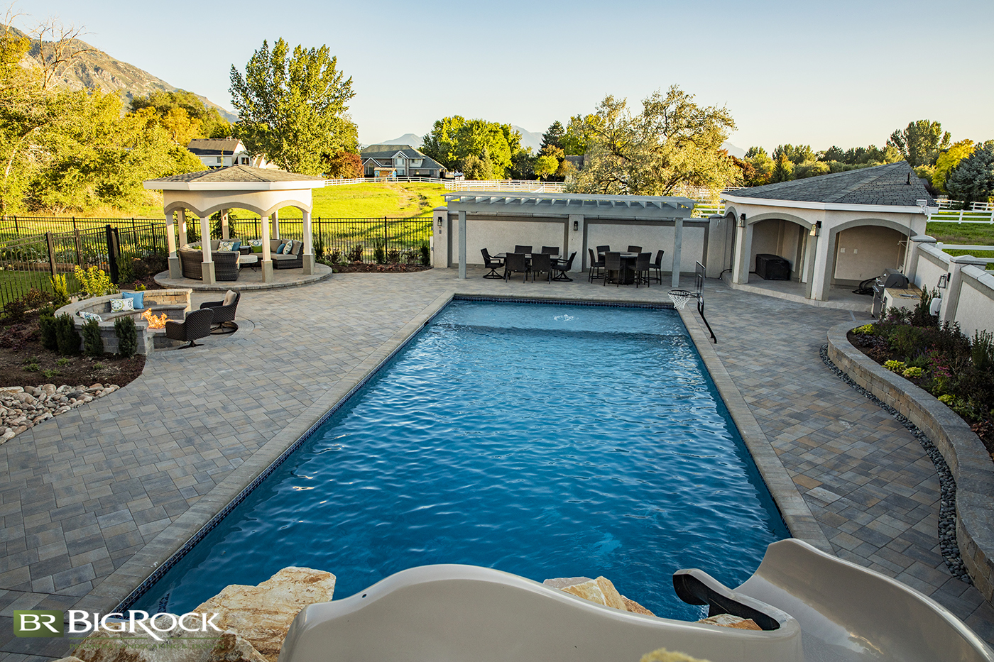 Installing a pool in your backyard doesn't have to take up all of your landscaping design. Create outdoor living spaces and gardens around your backyard pool for a complete landscaping design you can enjoy even when you aren't swimming.