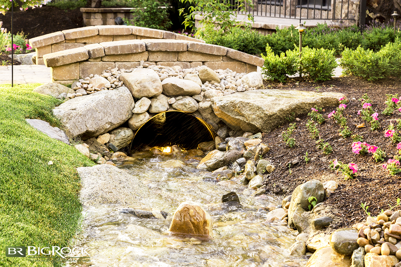 Big Rock Landscaping can design and install a natural creek with bridge so you can have nature running through your residential landscaping.