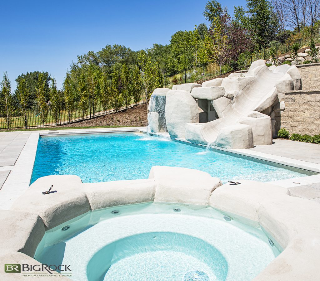 Rounded poolside slides and hottubs create a unique design and visual interest.