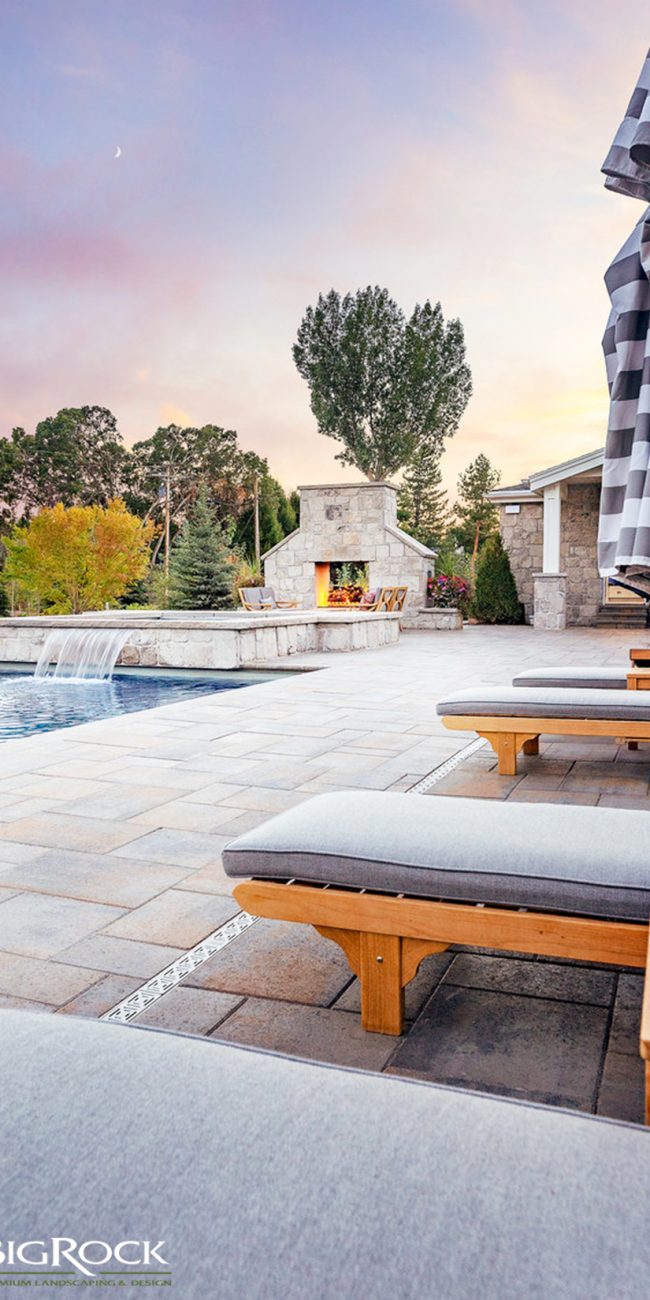 A luxury backyard landscaping design may include a perfectly placed water feature such as a water fountain or water fall in to your inground pool. Big Rock Landscaping can plan, design and install your luxury home landscaping.