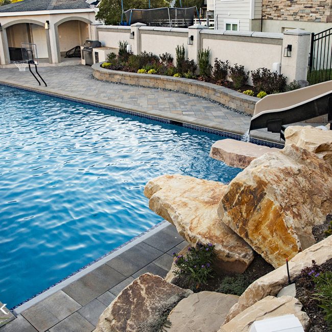 Whether you design your pool patio with pavers or natural rock, Big Rock Landscaping can help you create a design that elevates your backyard landscaping.