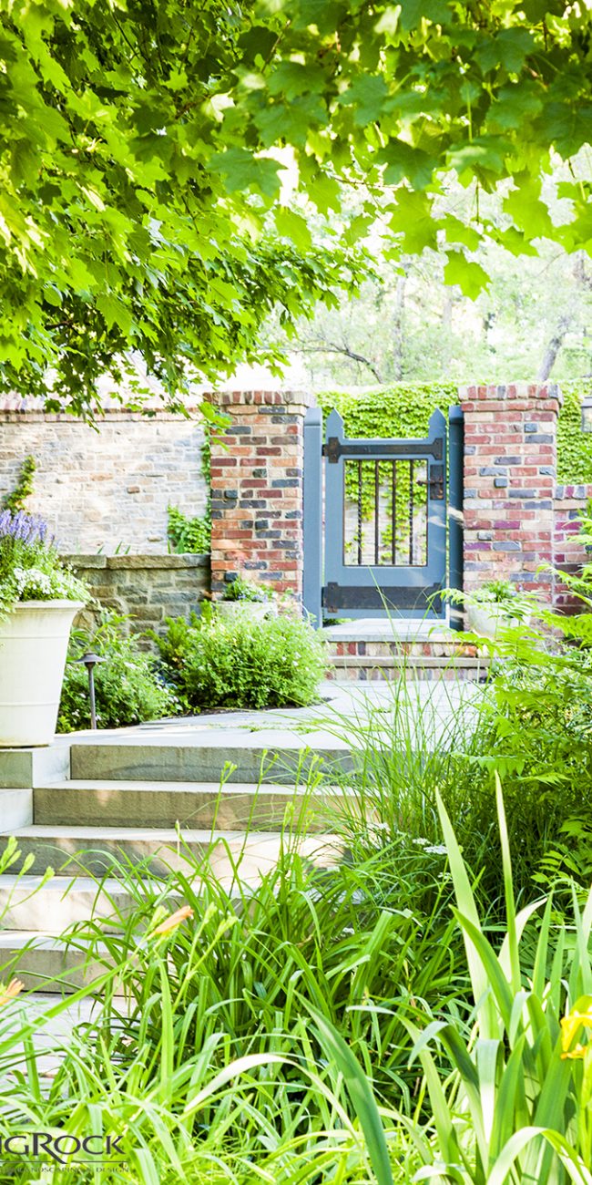 Don't let your landscape fencing and gates bore you. Create unique designs through different textures and colors such as including brick walls mixed with stone and wood gates.