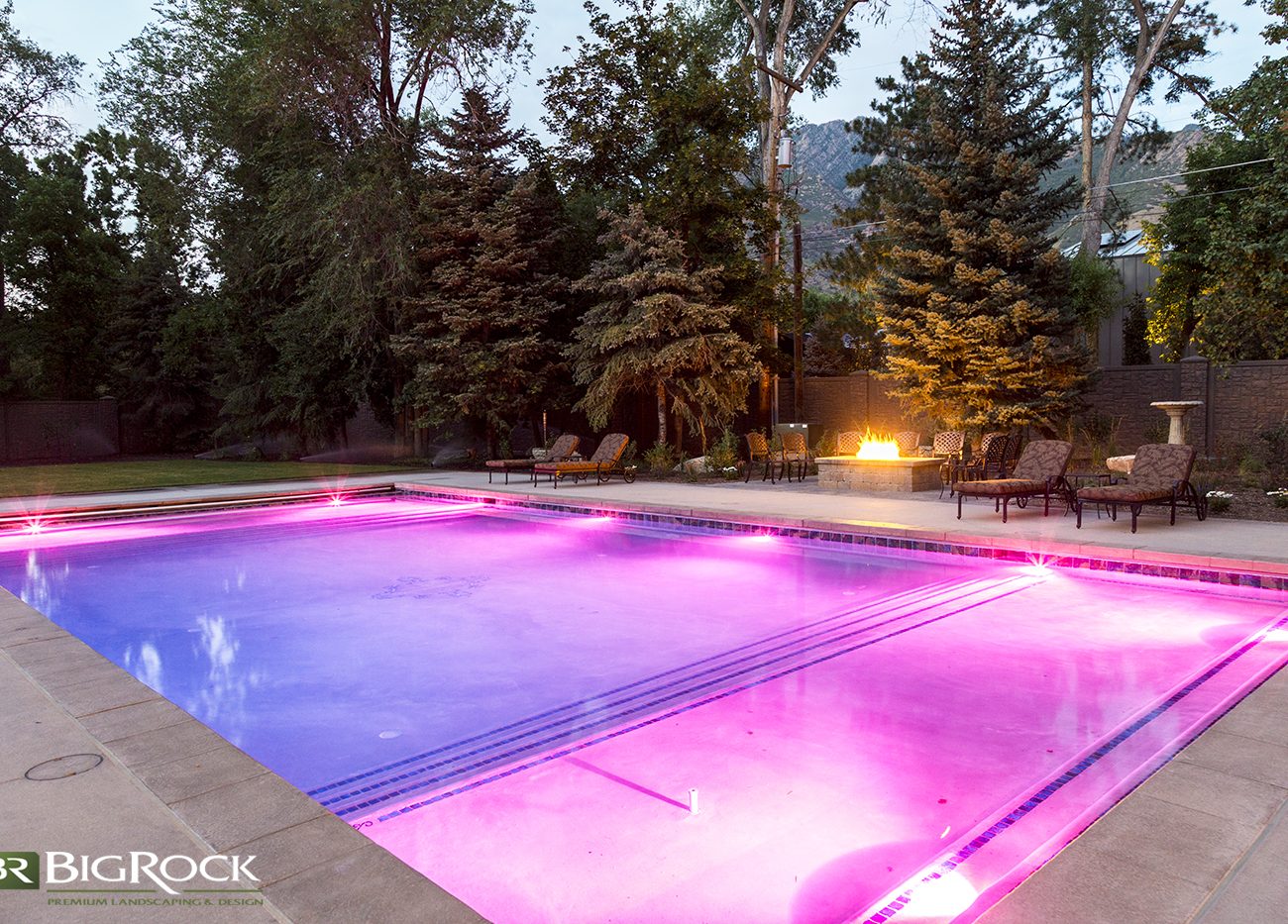 Don't let backyard pool lighting be boring. Big Rock Landscaping can make your pool the hit of the neighborhood with colorful pool light installation.