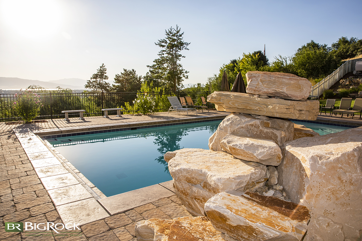 Create a natural swimming hole feel with a pool installation that includes natural rocks and stone. Whether the natural rocks are just decorative or part of a water slide, Big Rock Landscaping can build it.