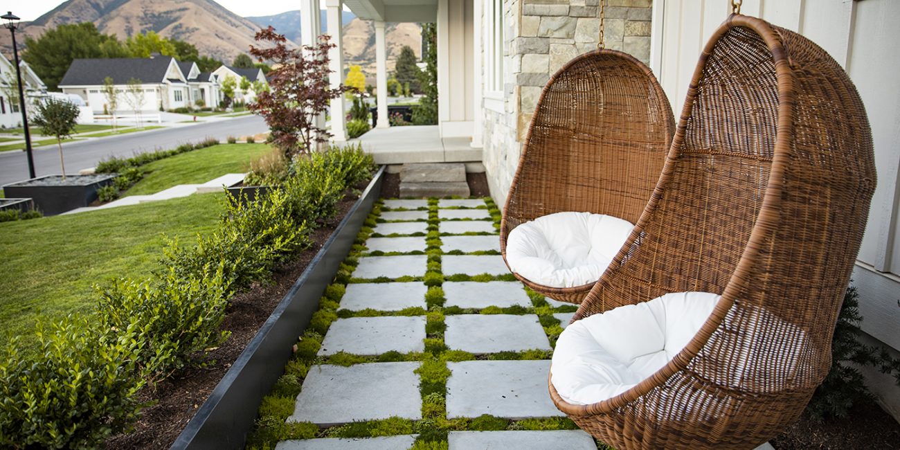 Landscaping walkways don't have to be solid stone or pavers. Add interest and design with green between walkway pavers.