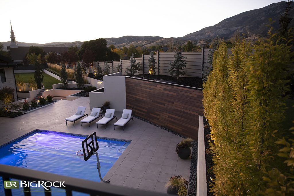 If your backyard landscape shape is unique, Big Rock Landscaping can create the perfect recreational design for use with a pool, sports court, beautiful retaining walls and garden beds.