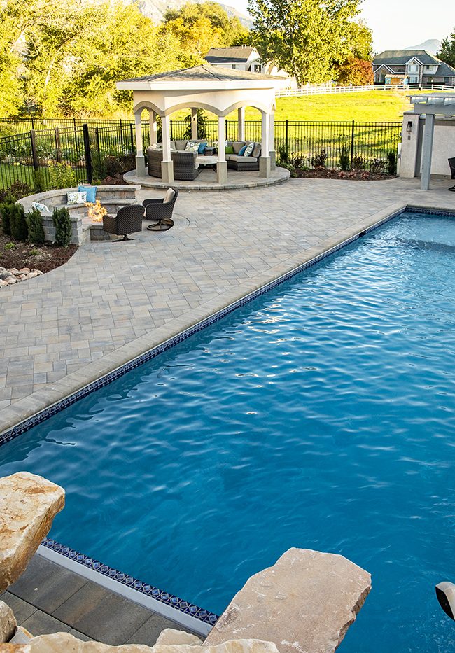 big backyard pool with patio