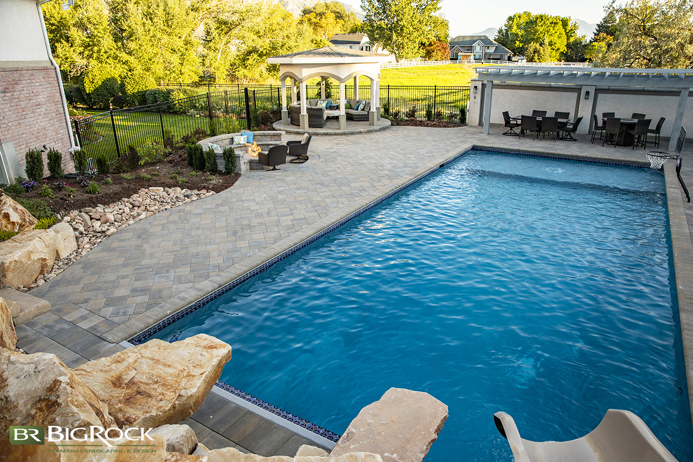 big backyard pool with patio