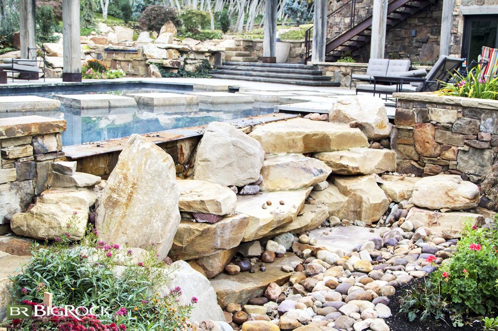 Rock landscaping is a beautiful way to bring nature into your structured backyard landscape.