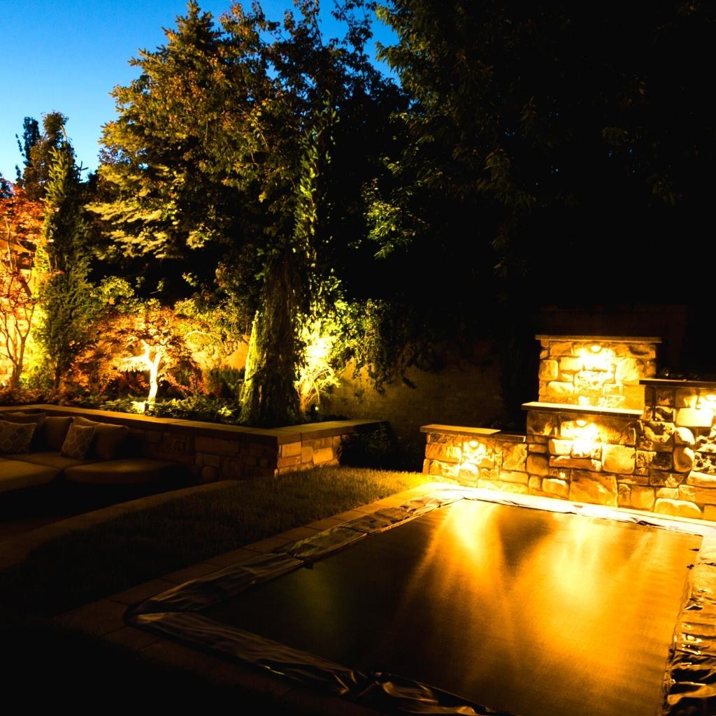 Custom lighting turns your yard into a warm, inviting, and safe place you can enjoy well after sunset.