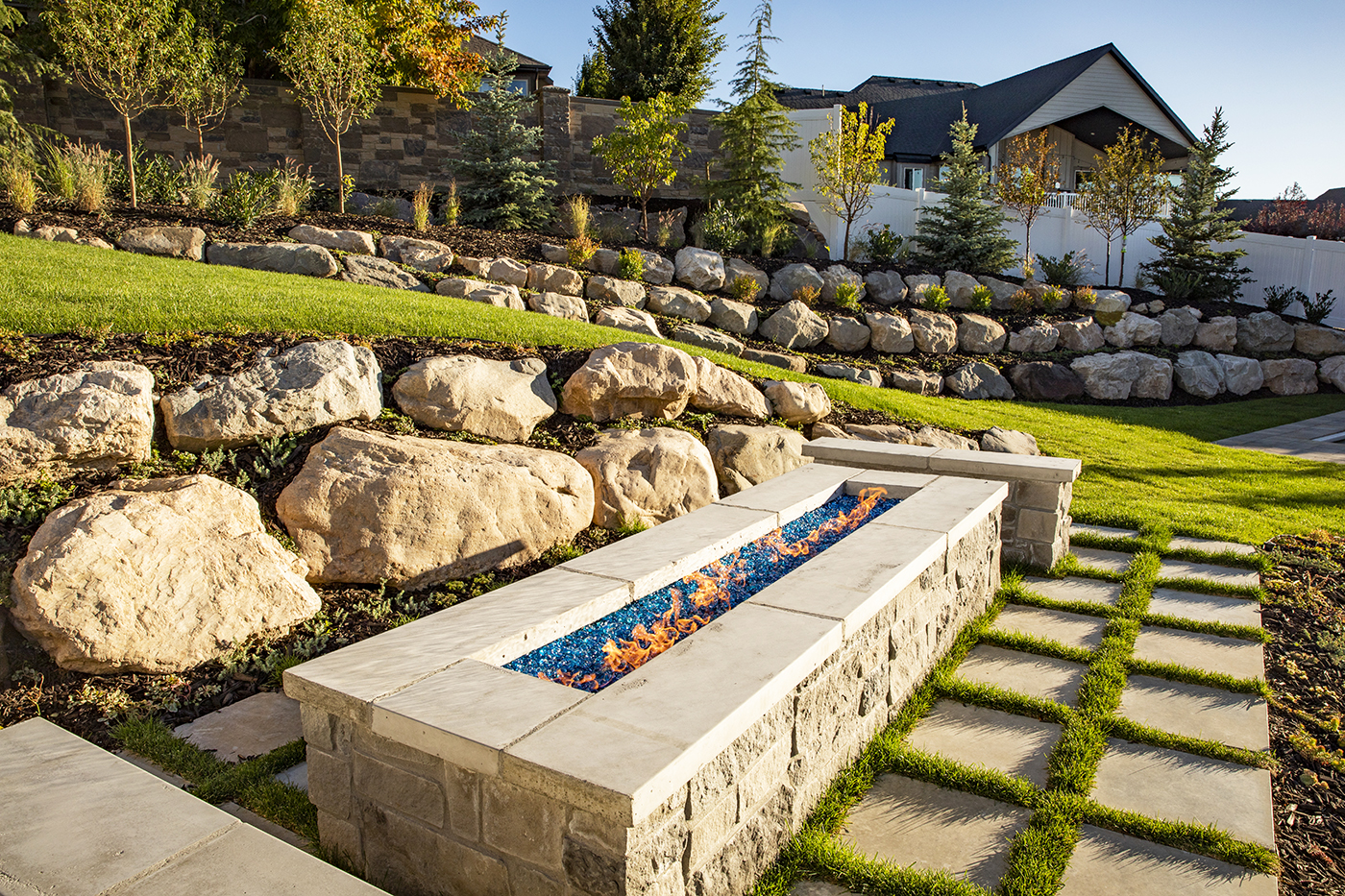 Stunning design and quality installation of your rock wall from Big Rock Landscaping will make your backyard your personal oasis without the pain of doing it yourself.