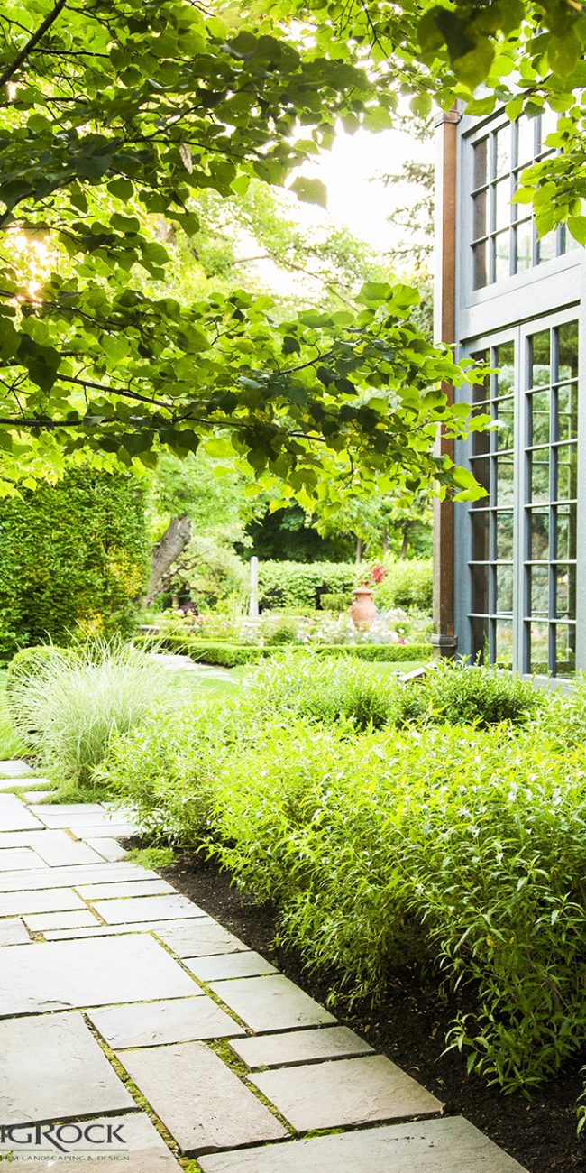 square paver walkway in luxury garden