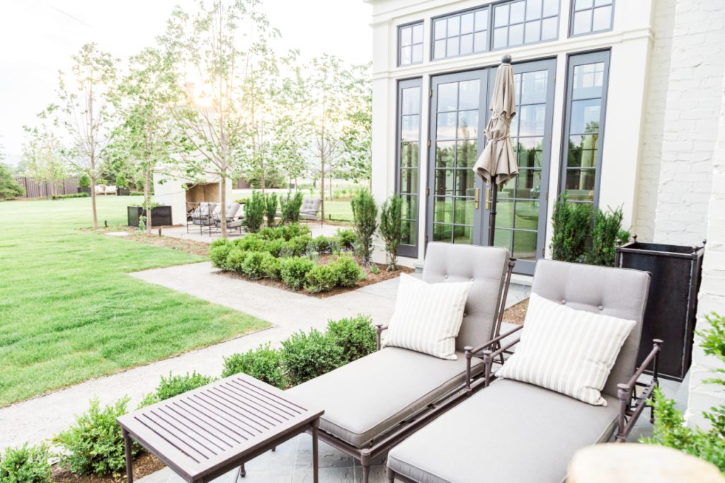 Spraying down hardscaping, patios, decks, and outdoor furniture is another important part of your spring yard checklist.