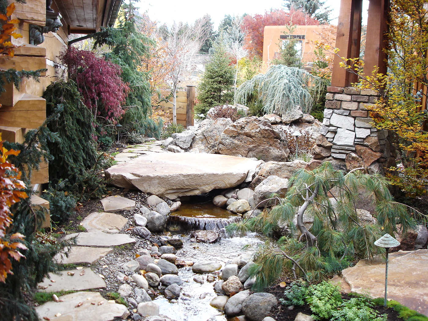 water fall stream feature for residential landscaping with boulders