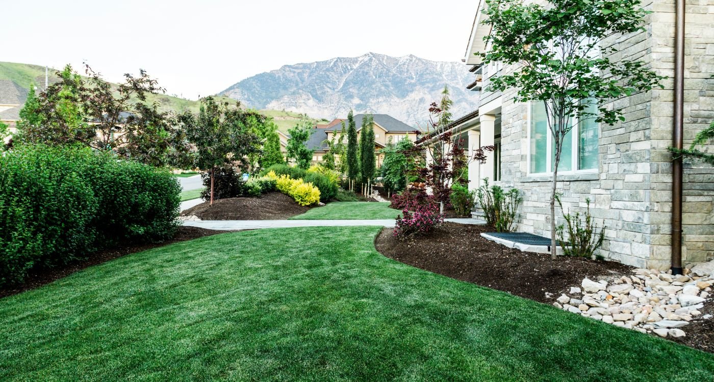 Mulching your yard is a critical step in a full, stunning garden during the spring and summer months. Not only does mulching moderate the temperature of the soil, but it traps water and prevents weeds from overtaking the area