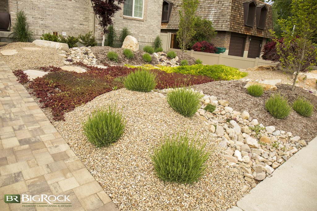 This xeriscape landscape has tremendous visual appeal as it mixes different varieties of rocks and plants.