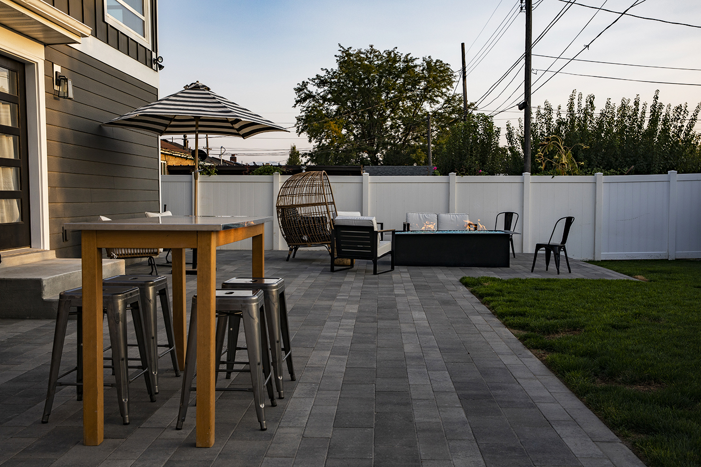 Bar height outdoor dining sets are great for entertaining, but without a solid place to set the table, like these pavers, it would be difficult to enjoy your meal. Big Rock Landscaping will make your outdoor dining dreams come true with thoughtful plans and professional installation.
