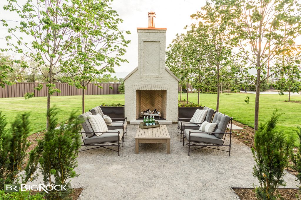 Enhance your backyard fire pit with a breathtaking fireplace structure. Big Rock Landscaping will help design and install a backyard fireplace structure that compliments the styling of your home.