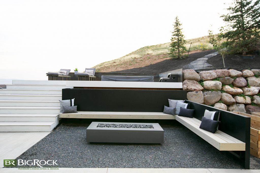 Not all backyard fire pits have to be rustic. Elevate your home fire pit with custom wood benches, modern concrete gas fire pit and clean lines.