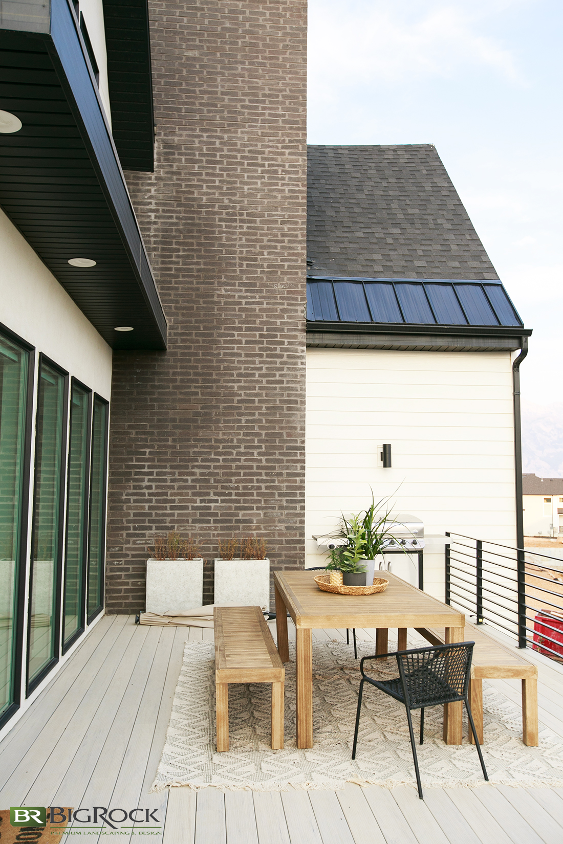 Expand your outdoor living experience with an attached deck. Bring nature to your with potted plants and foliage.