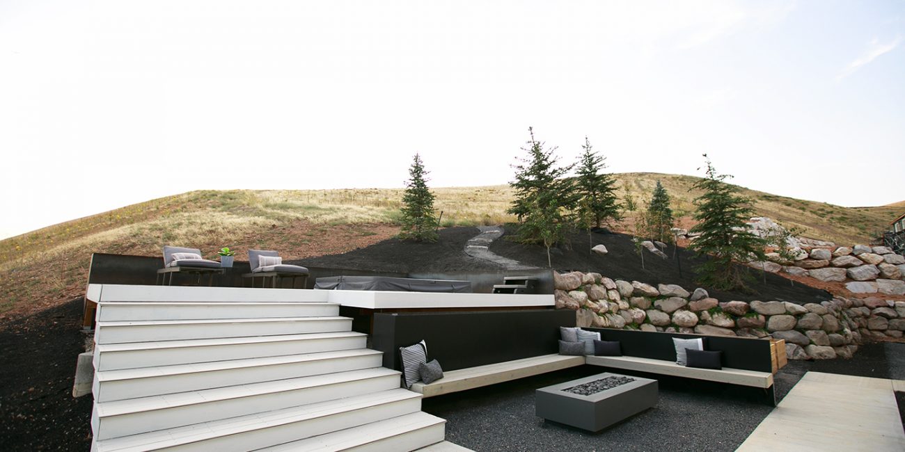 Get cozy in your personal backyard spa with a hot tub, wood deck and gas firepit. Big Rock Landscaping in Utah can create custom designs and builds to fit your unique landscape layout.