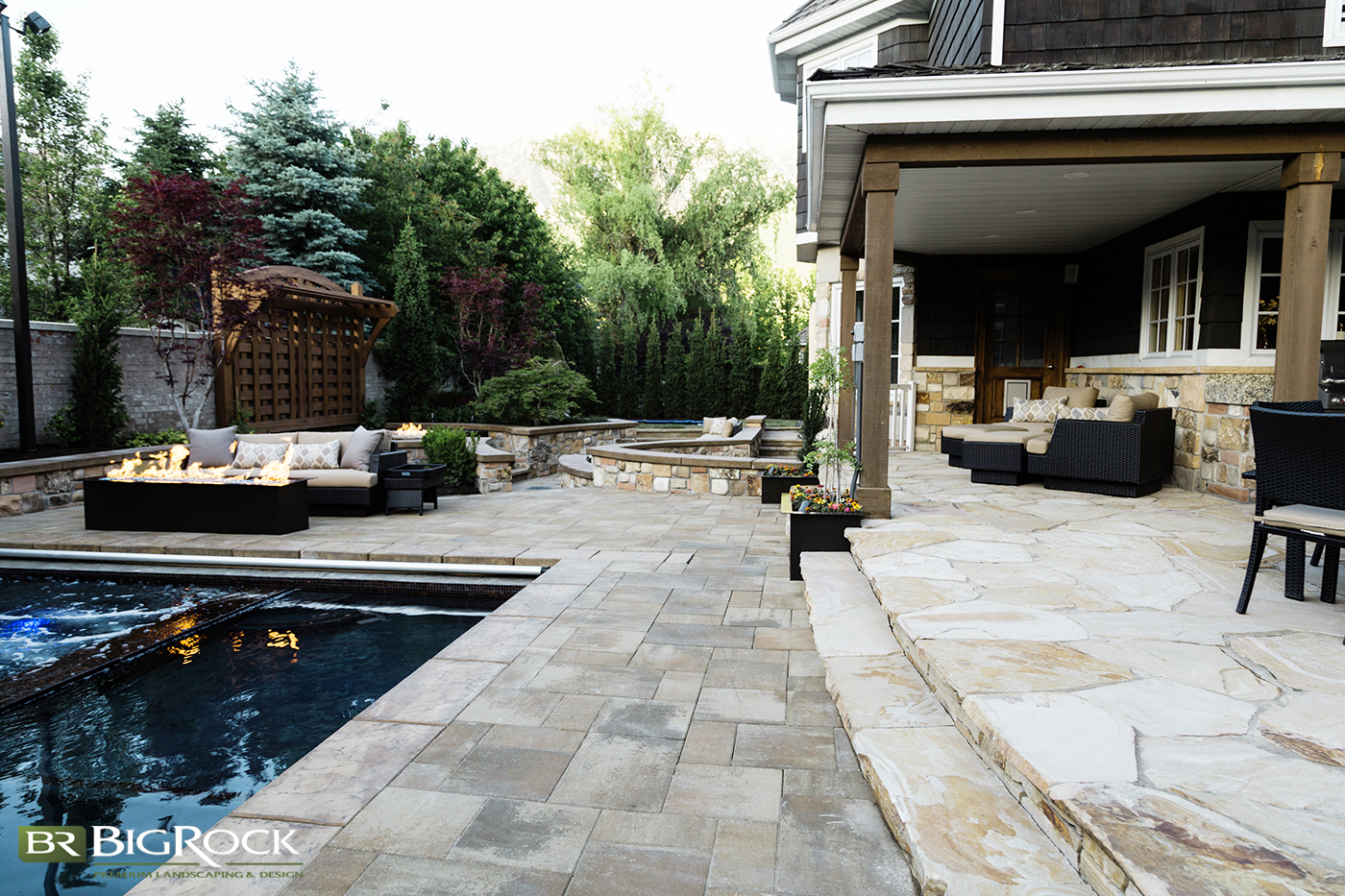 Mix natural shape stones with geometric patterns of stone pavers to break up harsh lines and create visual interest in your landscape design.