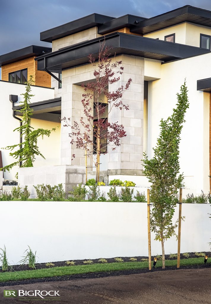 Not only does the yard feel like one flowing area, but it also blends beautifully with the wood, black and white exterior of the home, creating a cohesive look for the whole space