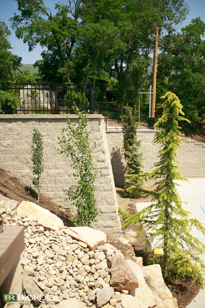 We used multiple types and sources for the retaining walls, including boulders and brick