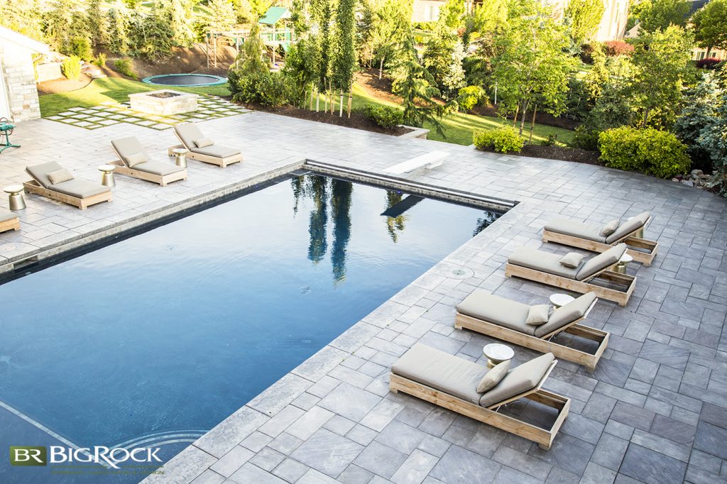 Balance the softscaping and hardscaping elements, and choose the right additions for the space, i.e. pools, pergolas, fire pits and fireplaces, outdoor kitchens and grills, furniture, and accessories.