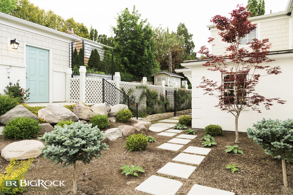 While that’s one way of doing it, there are so many other ways to use bark, rock, and other hardscape and softscape materials to conserve water in Utah while still having a beautiful yard