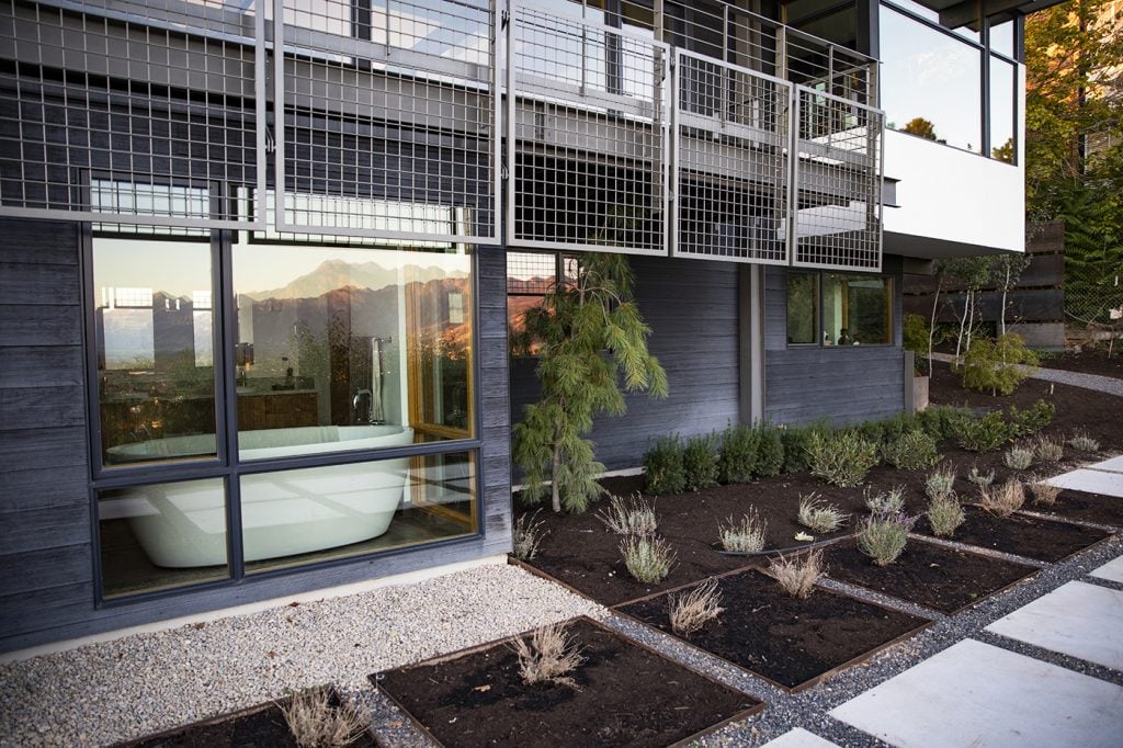 Ordinarily, the use of steel like this can make a space feel cold, but when used with the rich deep contrasting soil of these planting areas, it feels refreshing