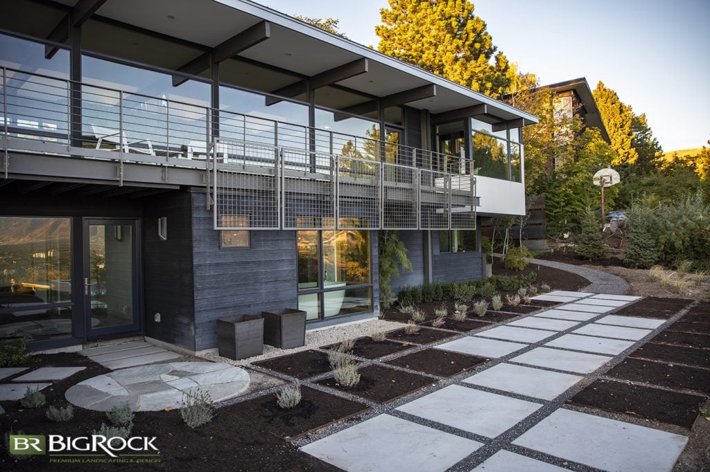 This home does a fantastic job of blending its outdoor spaces and echoing elements from the home to create the outdoor space.