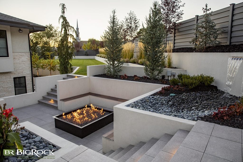 We love how this space creates different functional areas of outdoor living space. With separate lounging, eating, and socializing areas, this backyard becomes the perfect space to spend a lazy summer Utah afternoon