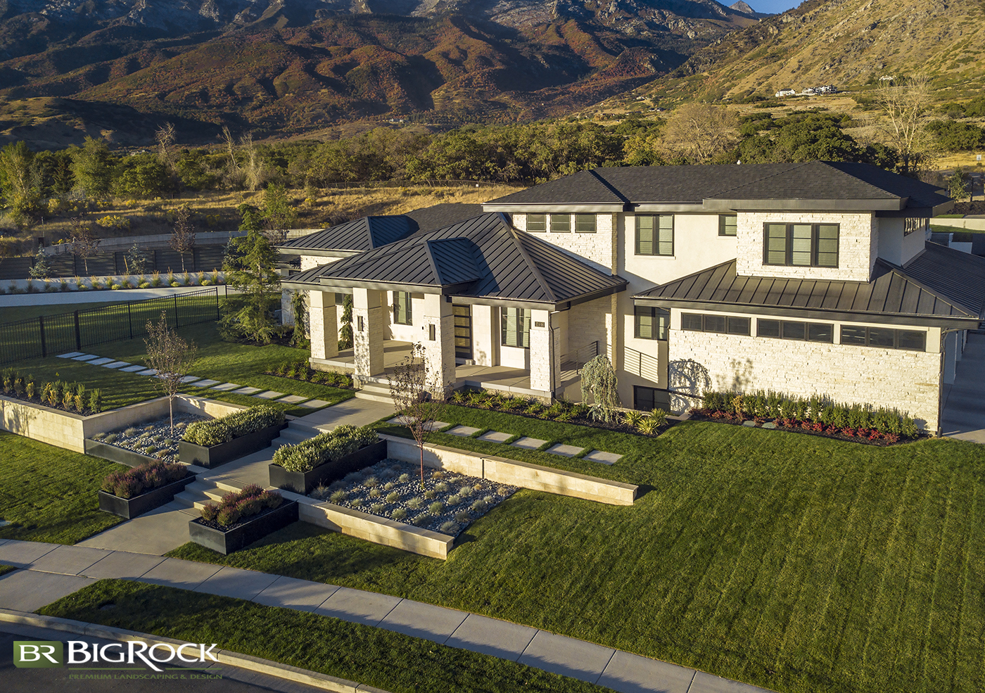 Modern landscape design is fundamental in this front yard. Because modern design uses clean lines and simplicity, we could add retaining walls, custom metal planter boxes, and modern pavers to the front yard.