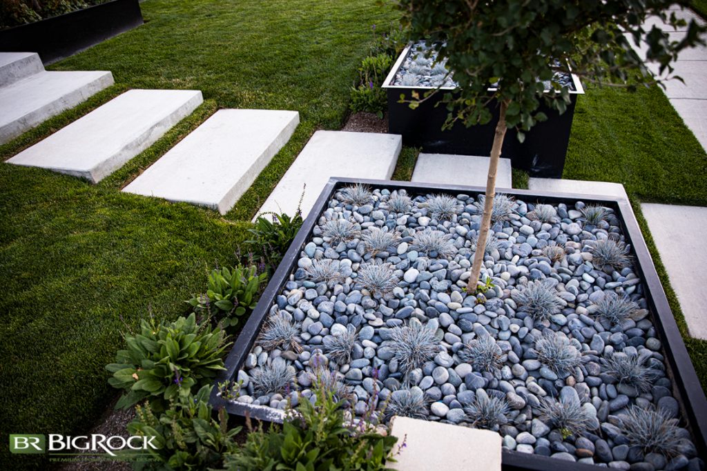 The black planter boxes stand out as a focal point, and they coordinate with the black roof of the home.