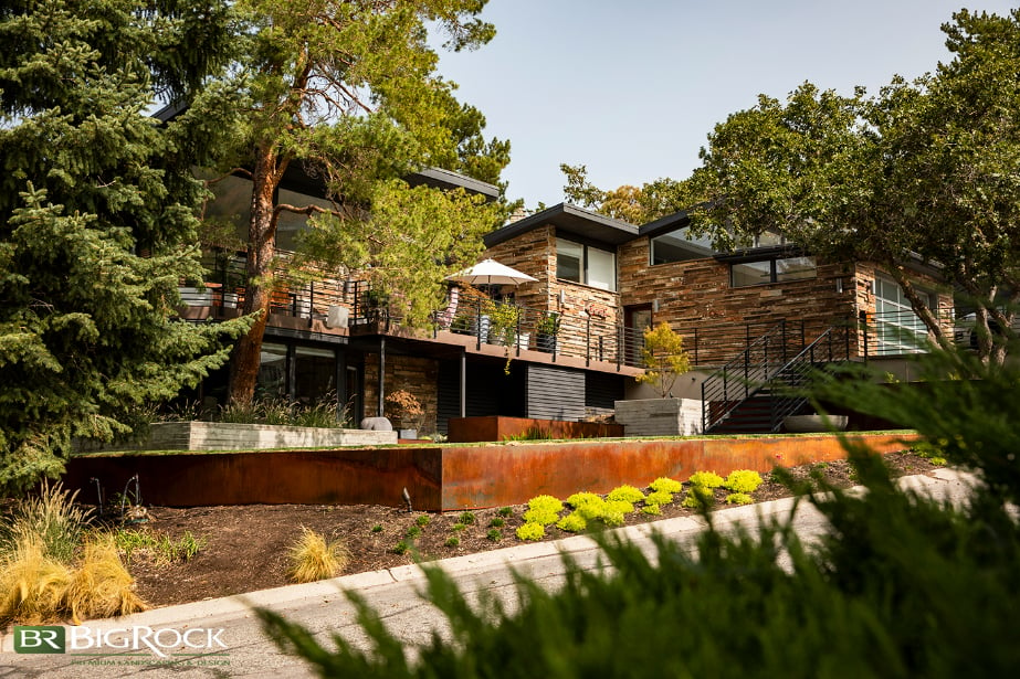 This home utilizes native plants and a large front deck, which improves the curb appeal and makes the space more usable.