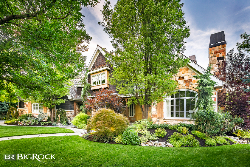 Native plants are strategically placed in planter areas in this front yard. This lowers overall maintenance while still allowing for plenty of lush green lawn.