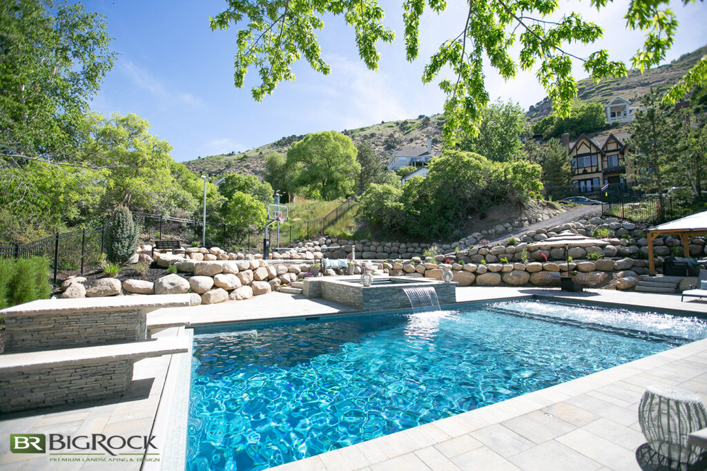 This property is no exception—note how there are layers of retaining walls to add more usable space, like the basketball court on the left or the pergola on the right.