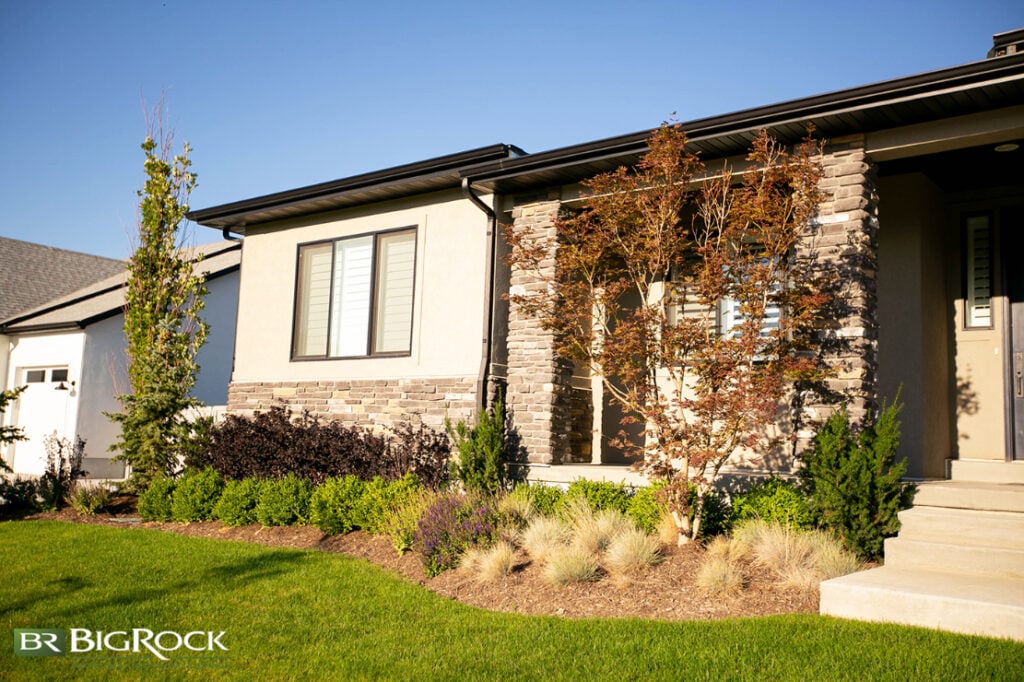 Don’t be afraid to layer taller plants behind shrubs and bushes, and don’t forget ground cover! This adds depth and dimension to the yard, which actually makes it feel bigger and more luxurious.