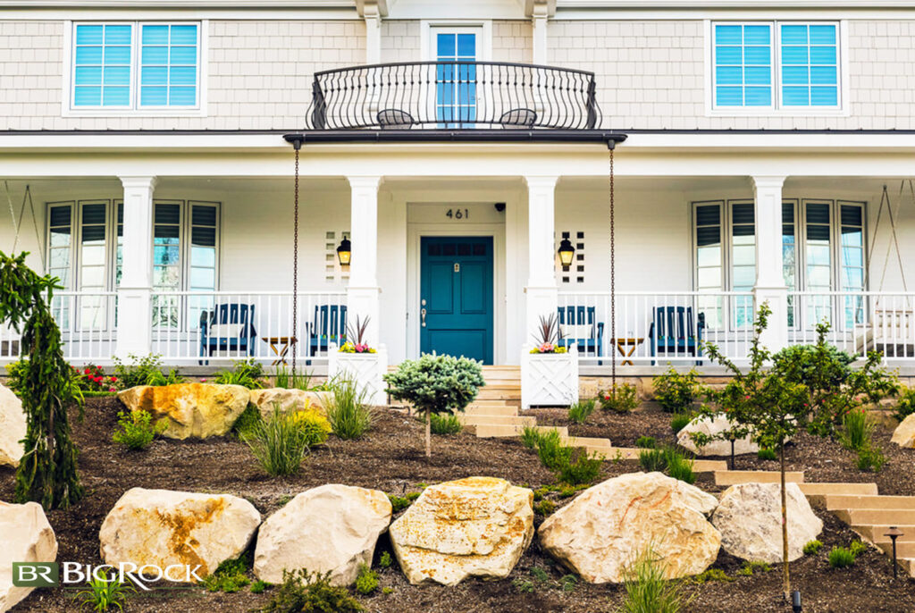 Between the tiered rock features and the varying height of plants, we love that everything in this front yard draws the eye toward the house as the main feature.