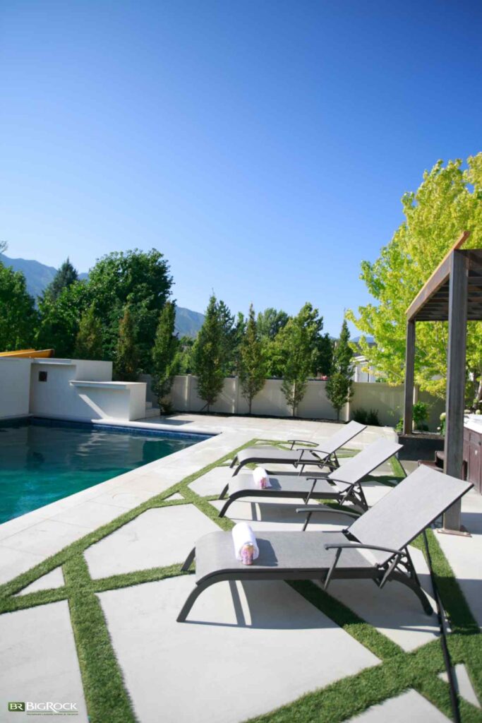 A professionally designed poolscape by Big Rock Landscaping featuring custom privacy hedges that enhance comfort, beauty, and outdoor living in Utah.
