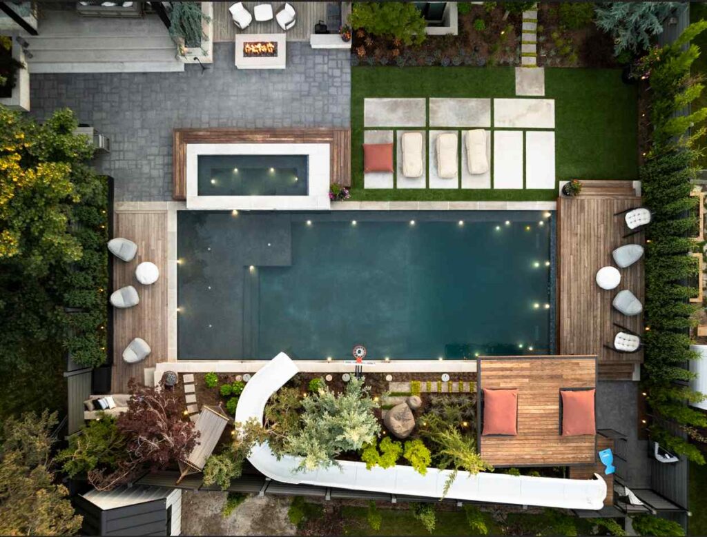 A thoughtfully planned poolside landscape showing proper spacing and placement of privacy shrubs for long-term growth and visual balance.